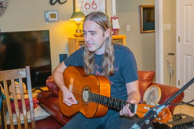 Sam taking guitar lessons