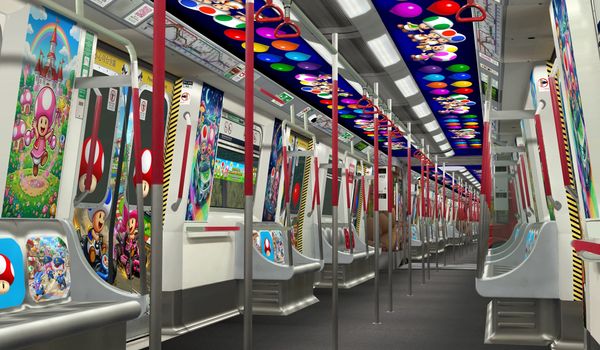Subway car decorated with colorful Mario-themed artwork and characters.