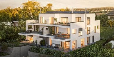 Modern white multi-story house with balconies and outdoor seating.