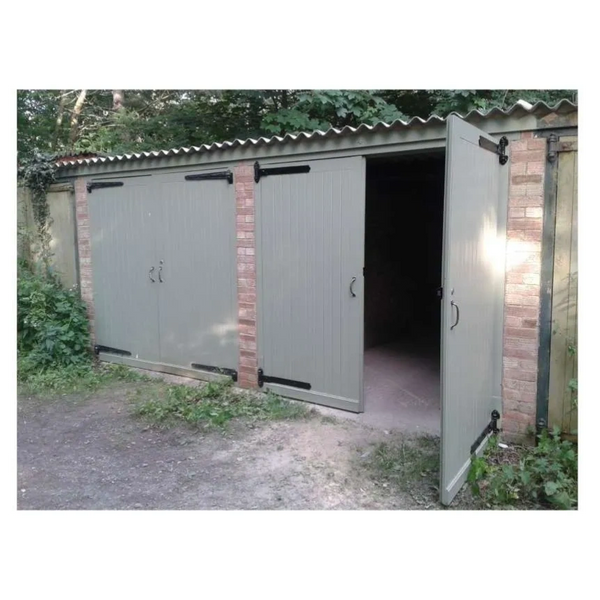 garage door repairs. Rotten timber doors repaired and painted. new black door hinges