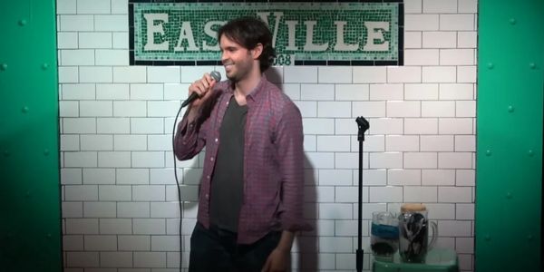 Man Standing in Front of a Microphone