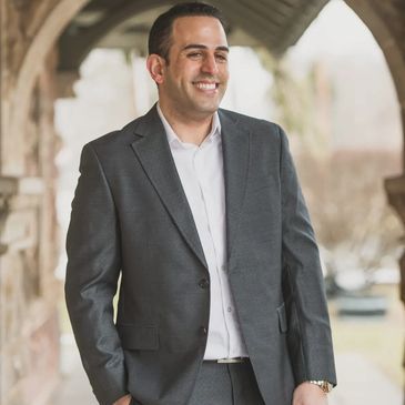 Eyal Al Levy smiling headshot on the display