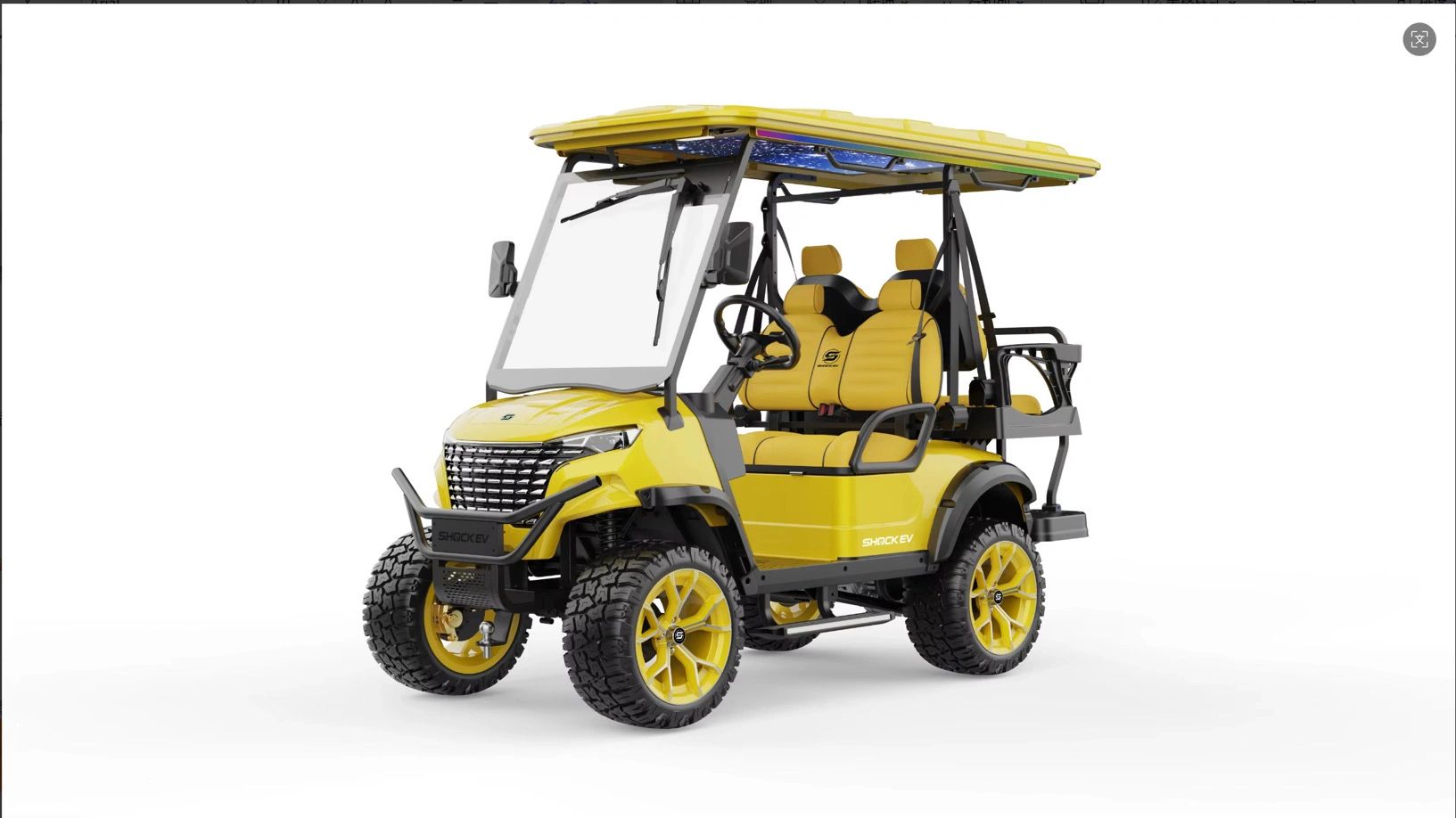 Yellow off-road golf cart with rugged tires.