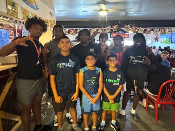Our players with UTRGV Football Players  