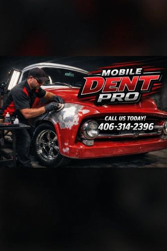 Man restoring a red vintage car's dent with Mobile Dent Pro service.