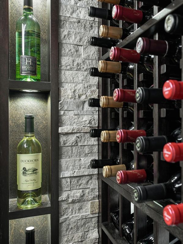 Wine bottles displayed in a cellar rack.
