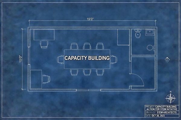 Blueprint of a capacity building room with furniture and restroom layout.