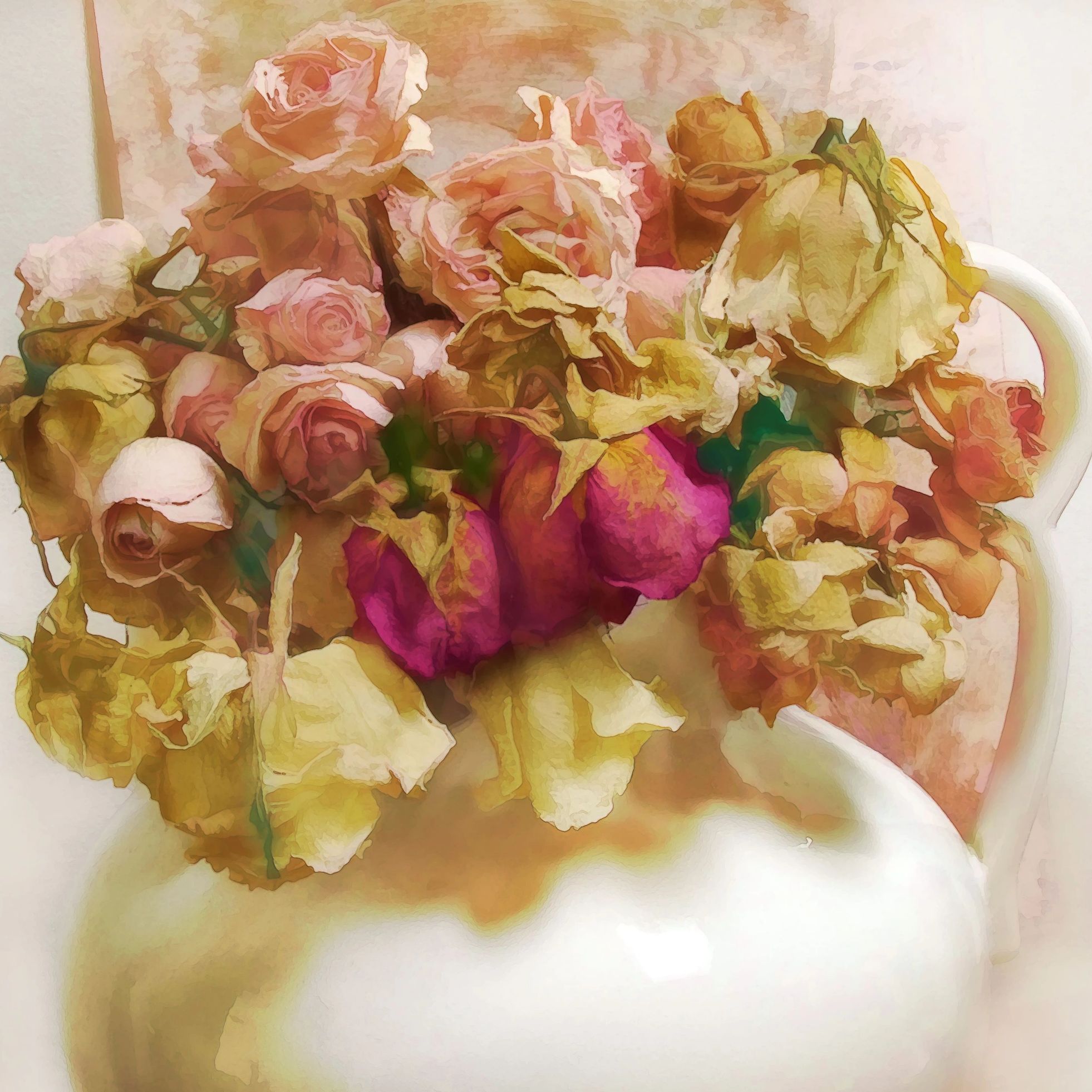 A ceramic jug holds a bouquet of dried roses in soft pastel hues.
