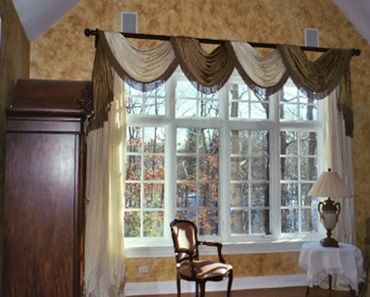 Cream and gold window draperies