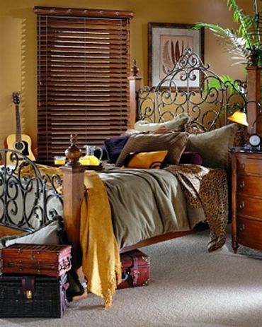 Wooden window blinds next to a bed