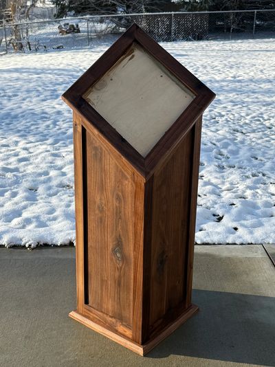 Rich dark walnut square pedestal with angled top for competition deer mount.