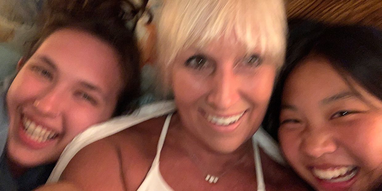 photograph of Jen Shafer and her two daughters laughing and smiling