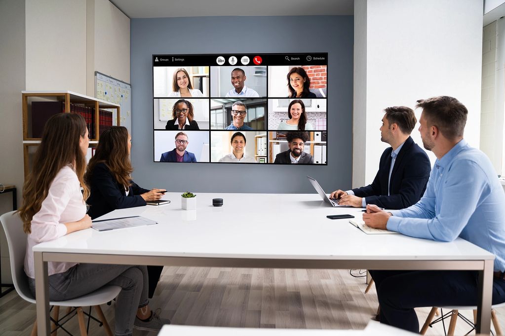 Team having a video conference in a modern office.