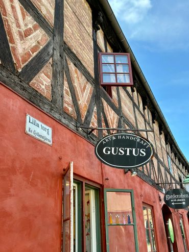 Colorful old building with artisan shop signs.