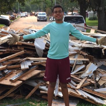 Dhiren Pena cleaning out damaged homes in Wharton, Texas