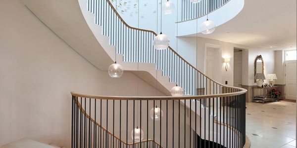 Continuous oak handrail with iron spindles