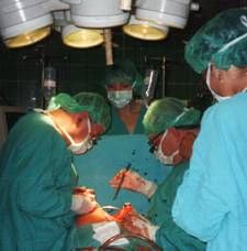 Surgeons performing cardiac bypass operation on paitetn with coronary artery disease