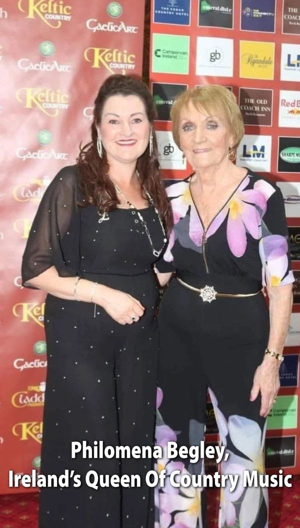 Philomena Begley, Ireland’s Queen of Country Music, posing with a companion at an event.