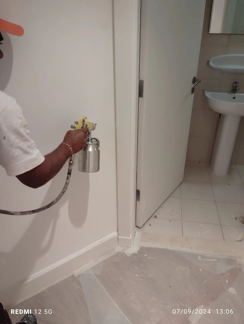 Applying Polyurethane paint to the door frame