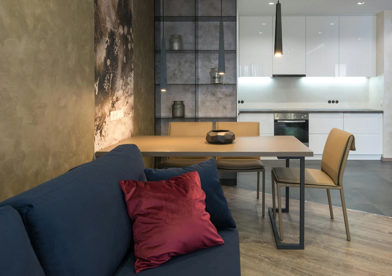 Multi use table and open kitchen to save space Multi use table and open kitchen to save space