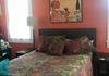 Master bedroom with queen bed with memory foam topper
