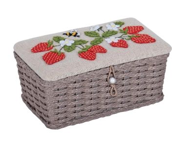 A woven basket with a fabric lid decorated with embroidered strawberries and flowers.