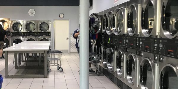 A row of laundromat dryers.