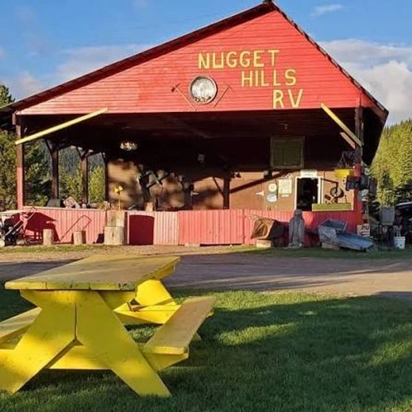 Red Nugget Hills RV shelter with a yellow picnic table.