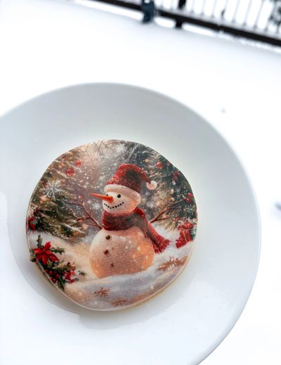 Round sugar cookie with an edible image of a Christmas snowman