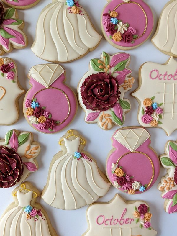 Bridal shower wedding sugar cookies with florals, gowns, rings, and calendars