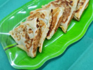 Vegetable Roti on a green leave shaped plate.