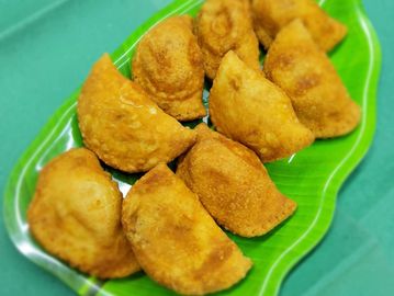 Fish and Egg Patties on a green leave shaped plate.