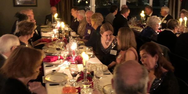 Elegant dinner party with candles and wine.