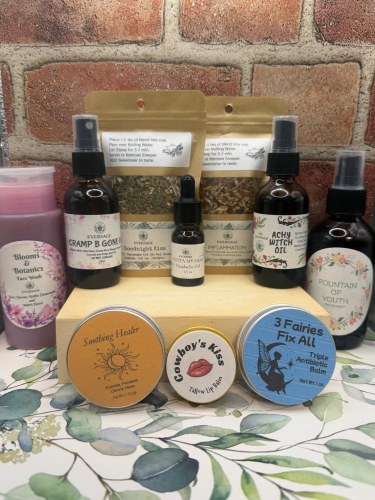 Natural wellness products including oils, balms, and face wash arranged on a wooden shelf.