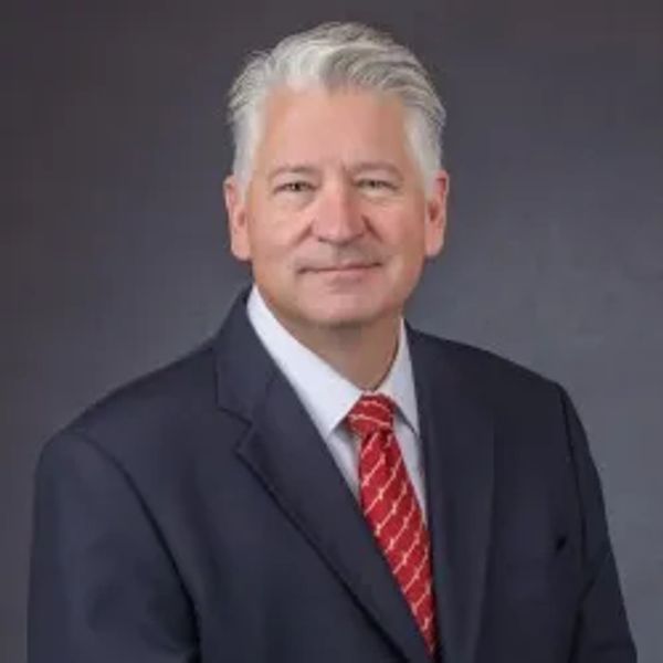 Professional man in suit and red tie.