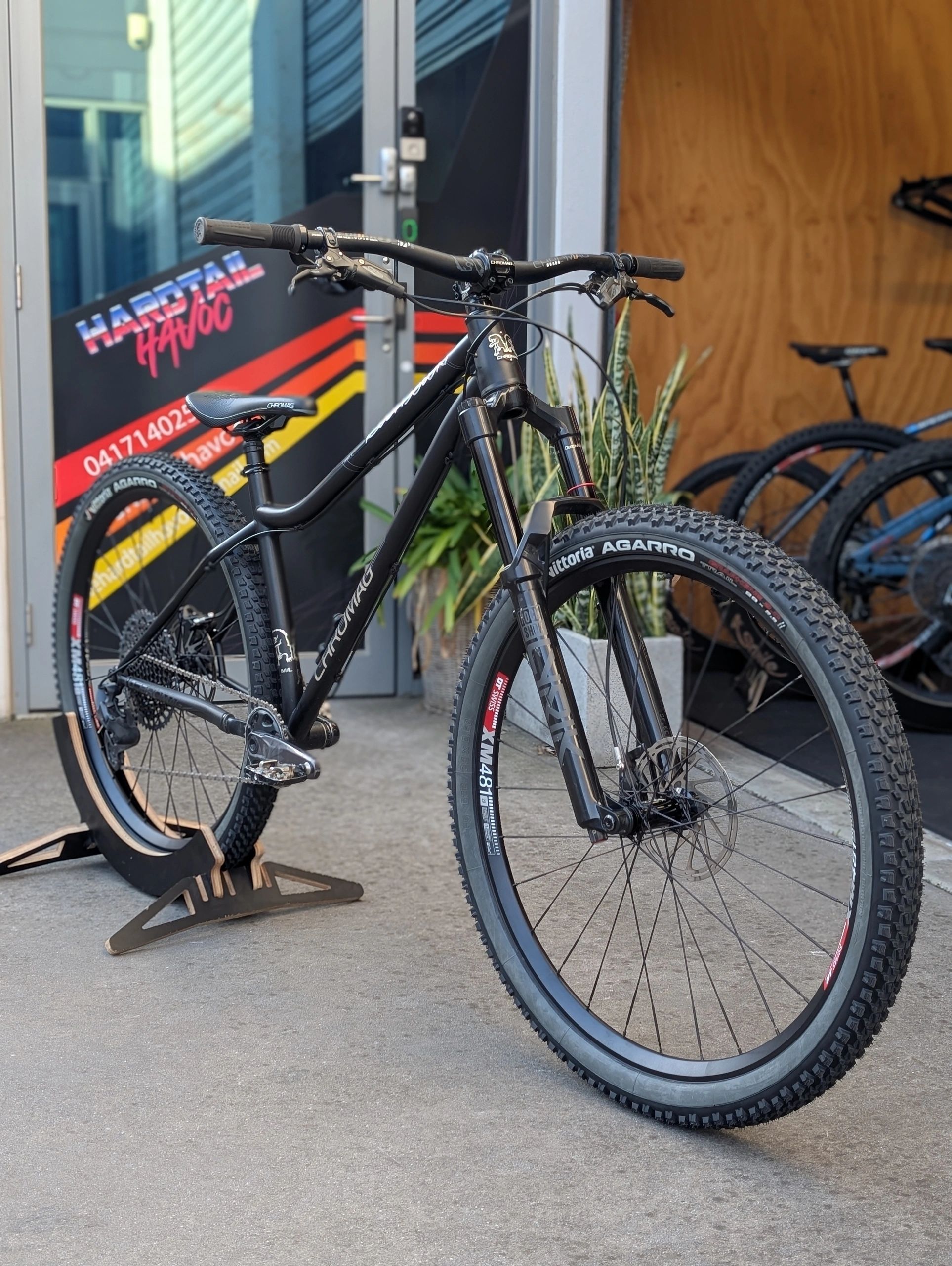 Black Chromag mountain bike with knobby tires in an outdoor setting.