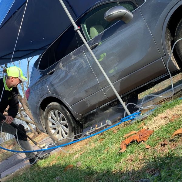 Washing the undercarriage of a Buick SUV