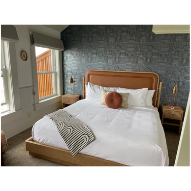 Restored guest room at The Sylvia Hotel in Newport, OR, with vintage charm and modern updates by Pro