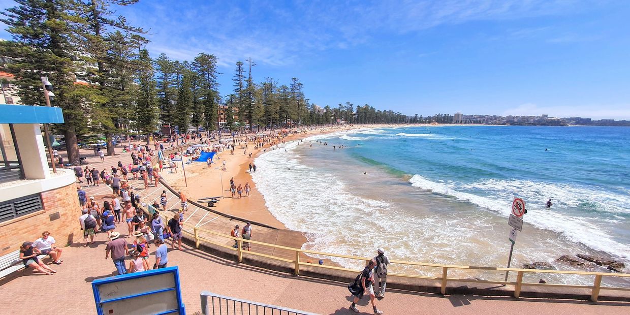 Filming the high tide views over Manly Beach in Sydney Australia