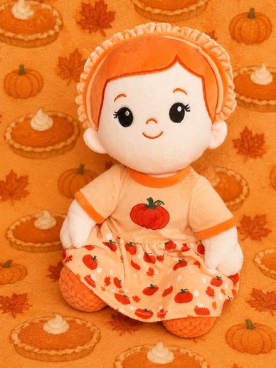 Cute doll dressed in pumpkin-themed clothes with autumn background.