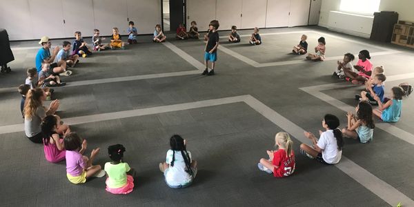 Kids laying on the floor. 
