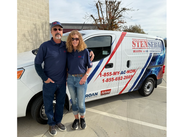 A couple stands in front of a StenServ Heating & Air Conditioning van.