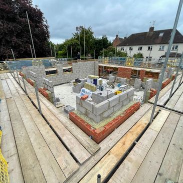 Construction site with brick and block walls under development.