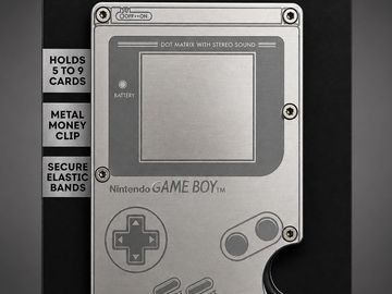 A silver Nintendo Game Boy-shaped metal money clip with card slots and elastic bands.