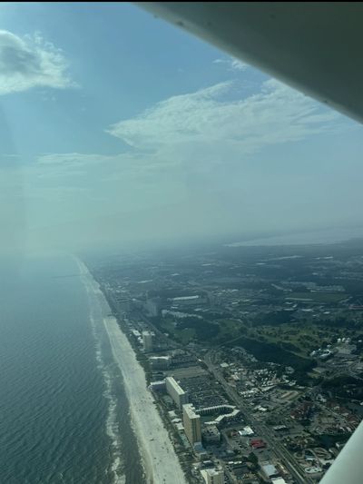 Aerial view of a coastline and city.