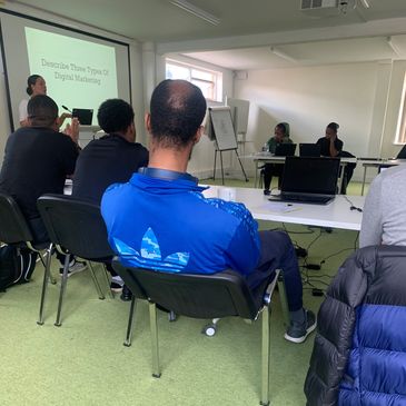 A group of people attending a presentation