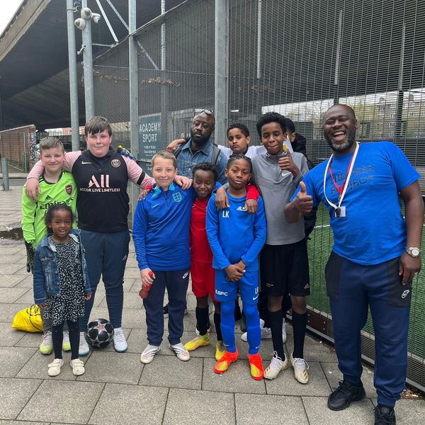 A group of kids with two coaches