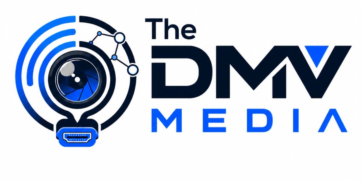 Logo for The DMV Media with a camera lens design.