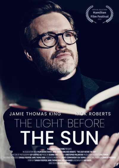 Promotional poster for the film 'The Light Before The Sun' featuring a contemplative man with glasses.
