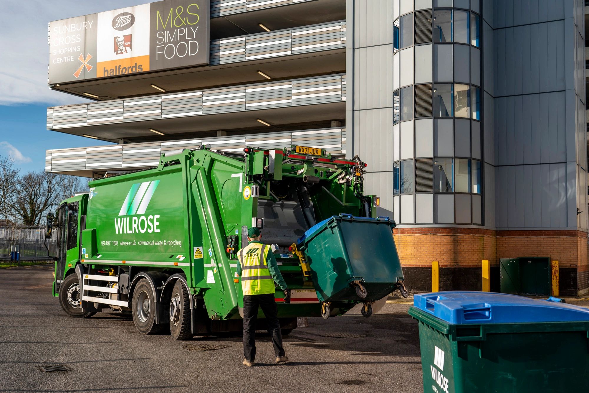Commercial dustcart collecting general waste in Wandsworth borough of London.